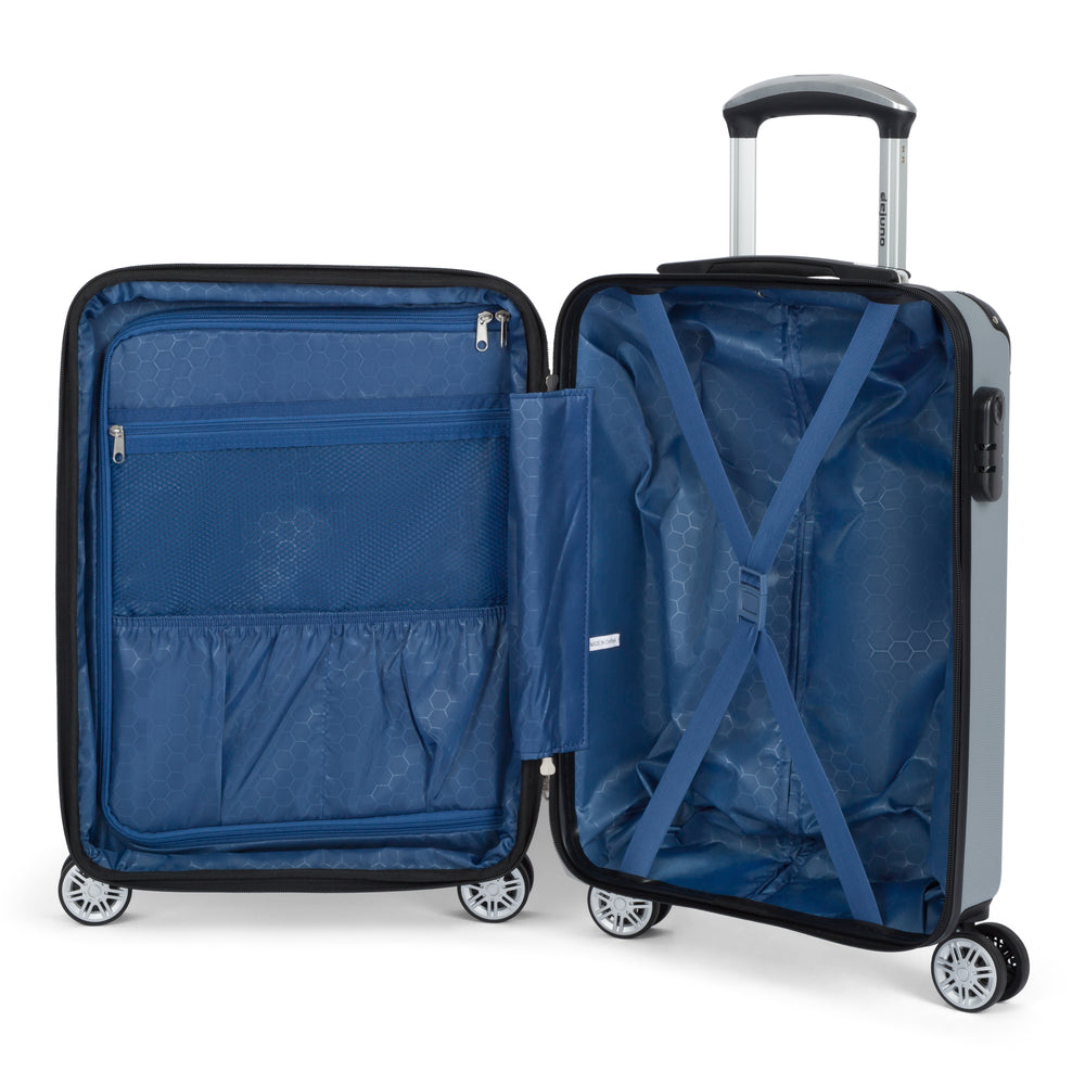 Compact II hardside carry-on spinner suitcase in Silver, open, showing the lined interior and compression straps