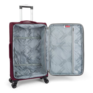 Atlantis softside spinner suitcase in Burgundy, open, showing the lined interior and compression straps