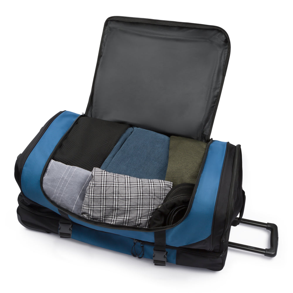 Excursion rolling duffel bag in Black Navy, open, showing the interior pockets