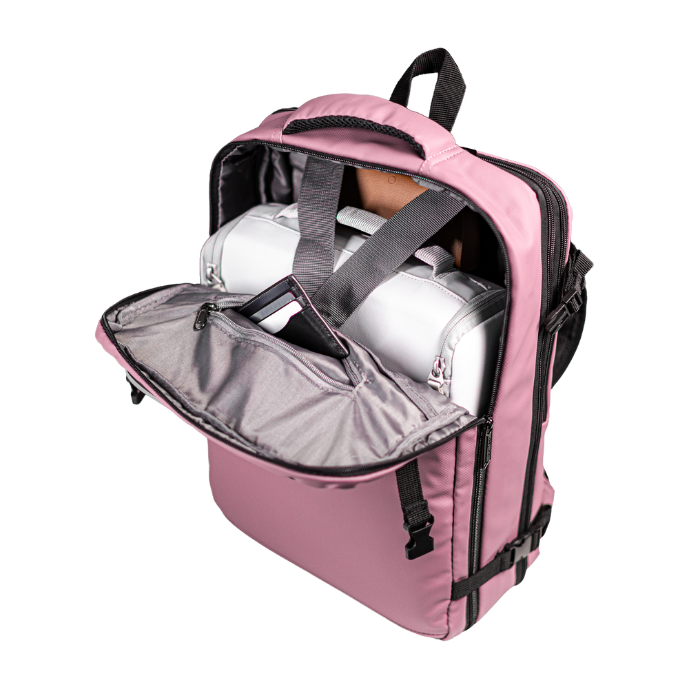 Stryde backpack main compartment open with interior straps holding contents in place